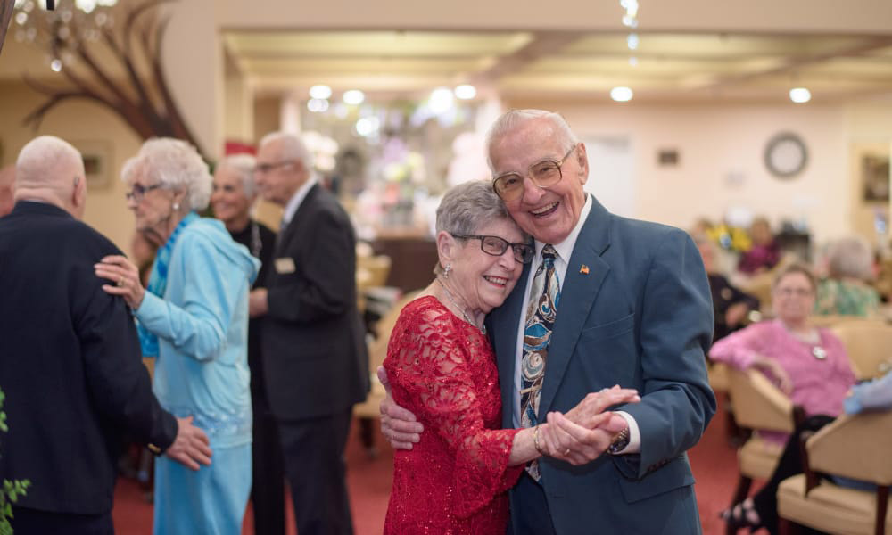 Senior couple dancing at a community event