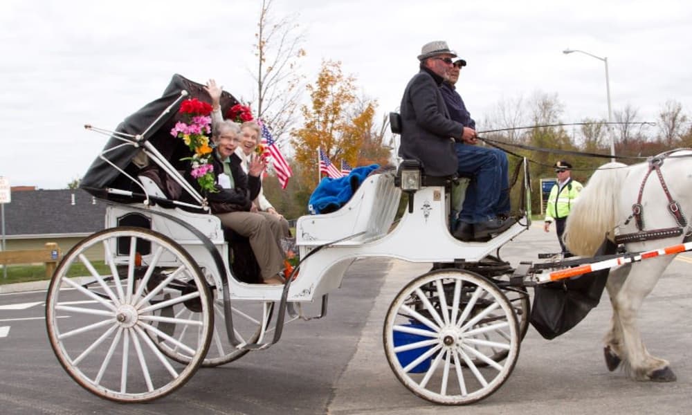 Ashton Gardens residents enjoying a horse drawn carriage