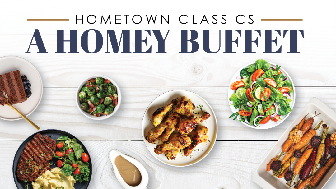 Overhead view of assorted dishes including chicken wings, salad, carrots, grilled steak with potatoes, Brussels sprouts, a dessert, and sauce under the text "Hometown Classics A Homey Buffet.