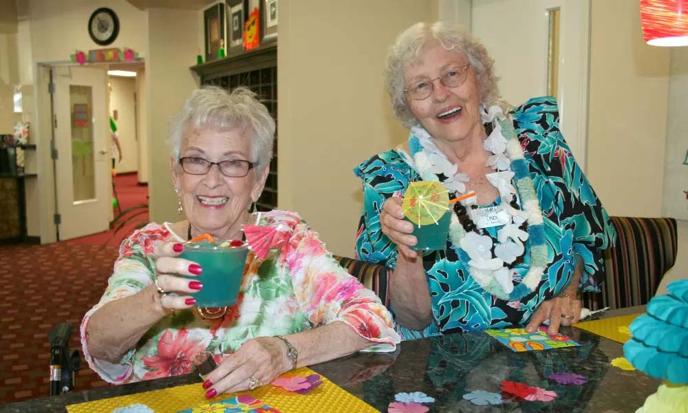 Senior residents playing bingo and toasting drinks