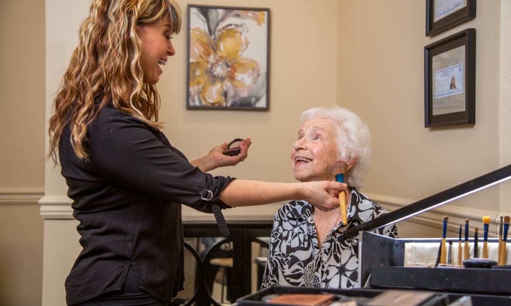 Hawthorn Senior Living. Camellia Gardens. Senior Resident Getting Her Makeup Done.