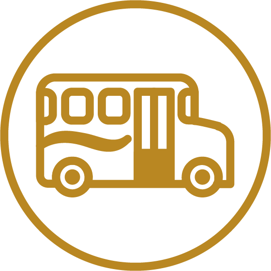 A simple gold outline of a bus inside a gold circle on a white background, symbolizing Independent Living. The bus features two wheels, windows, and a door.