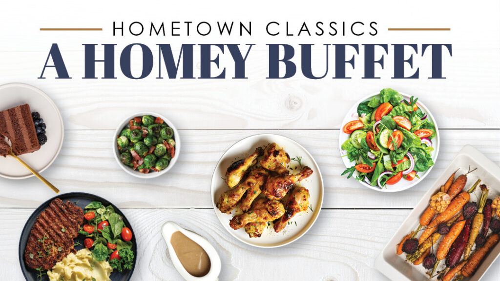 A buffet spread with grilled chicken wings, salad, carrots, brussels sprouts, mashed potatoes with steak, gravy, and a dessert bar on a white wooden table. Text reads: "Hometown Classics A Homey Buffet.
