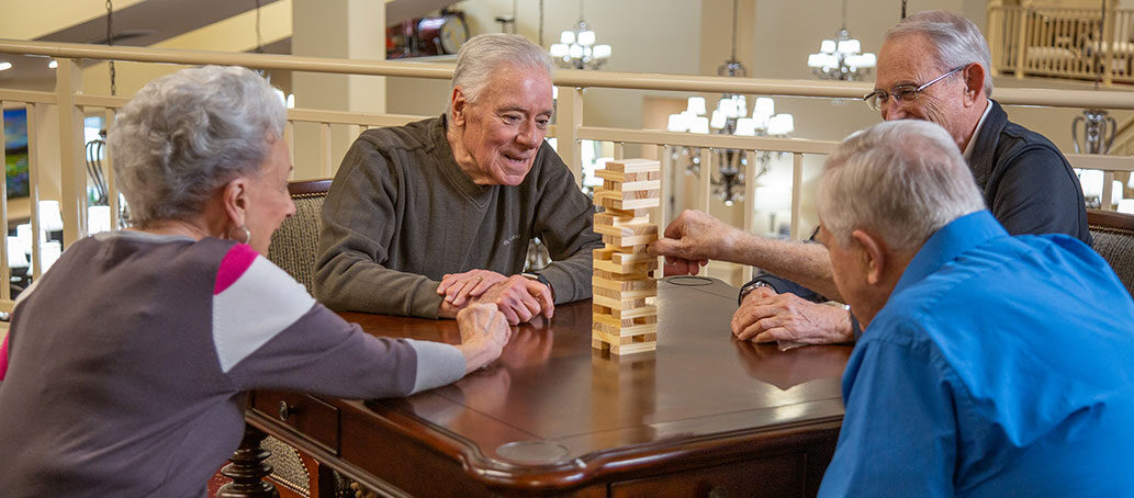 Hawthorn Senior Living. Colonial Gardens Senior Residents Playing Jenga.