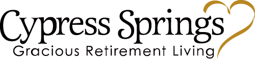 Cypress Springs logo featuring the text "Cypress Springs Gracious Retirement Living" with a stylized heart outline on the right.