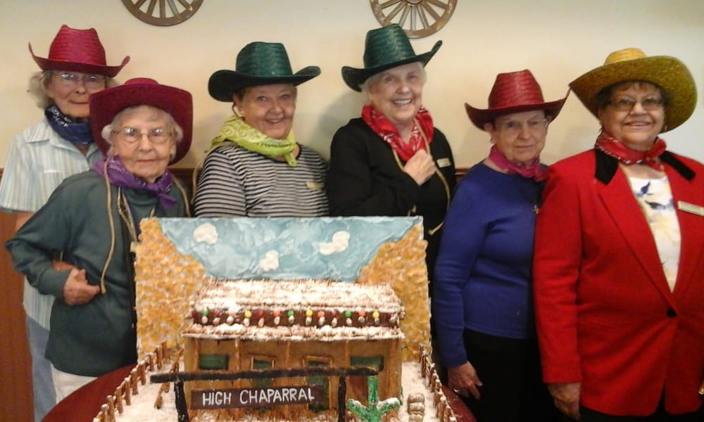Group of seniors posing with cowboy hats on