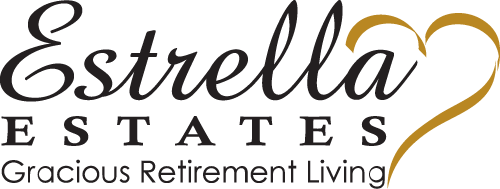 Logo for Estrella Estates Gracious Retirement Living. The text "Estrella Estates" is written in elegant cursive, while "Gracious Retirement Living" is written in smaller block letters below. A stylized yellow heart is integrated into the design.