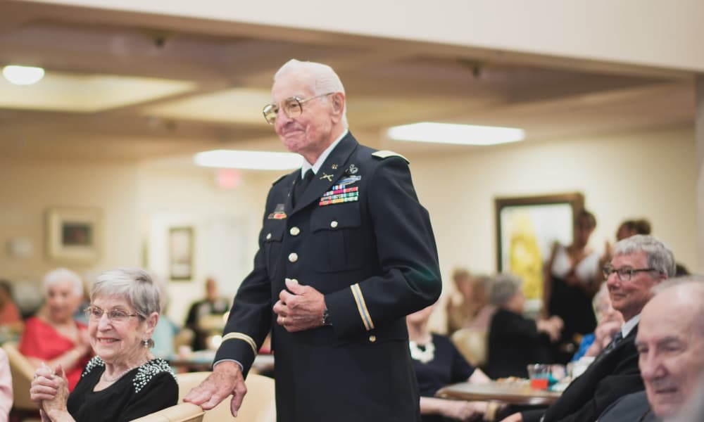 Male resident being honored for his service