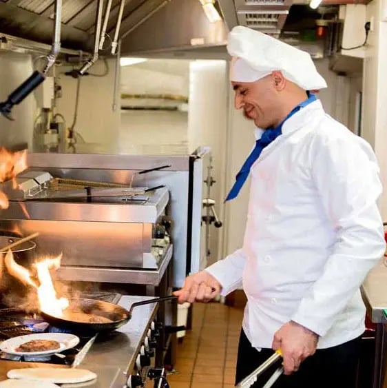 chef-cooking-meal-in-kitchen