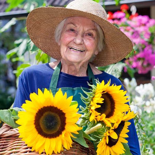 senior-woman-flowers-gardening-outdoors-e1717698817713