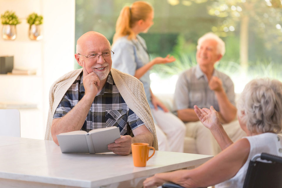seniors-man-woman-talking-book