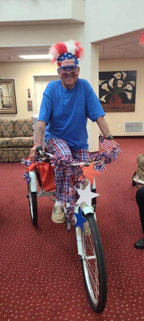 Senior on bike with July 4 attire