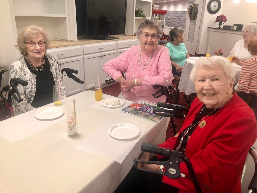 Senior resident sitting at the dining table on Mothers day