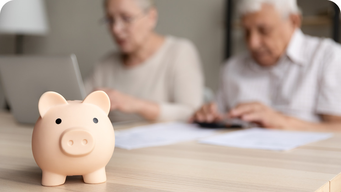 Piggy bank and seniors in the background