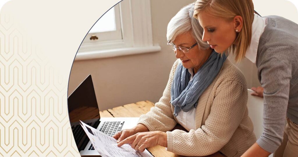 Senior and daughter reviewing paperwork