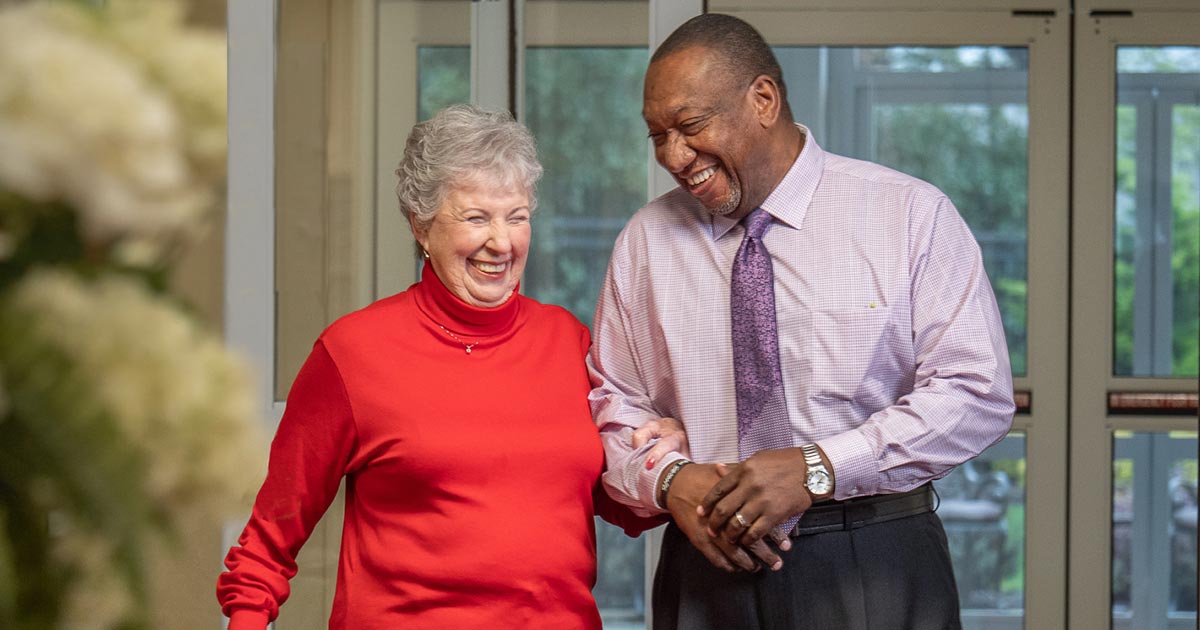 Senior couple walking and smiling