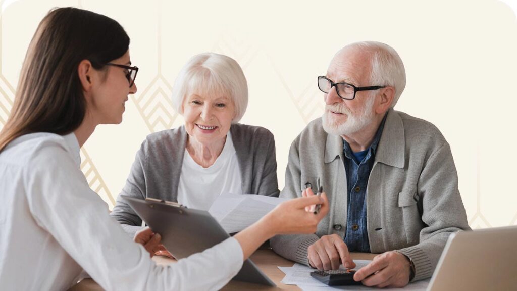 Young woman reviewing paperwork with seniors