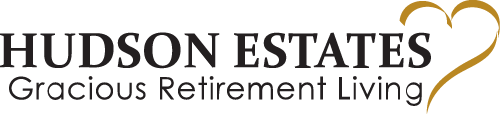 Image of the Hudson Estates logo with the tagline "Gracious Retirement Living." The logo features the text in black font and a gold heart outline on the right side of the design.