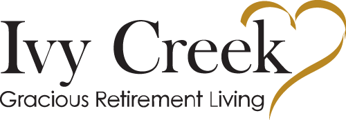The logo for Ivy Creek Gracious Retirement Living features the name "Ivy Creek" in black text, with the words "Gracious Retirement Living" below. A heart shape formed with a gold swoosh appears on the right side of the text.