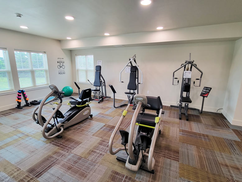 Liberty Heights work out room with work out machines