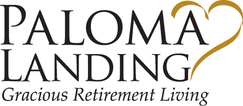 Paloma Landing logo featuring the text 'Paloma Landing Gracious Retirement Living' with a stylized gold heart integrated into the design.