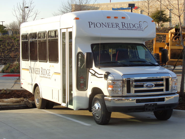 A white bus with the text 