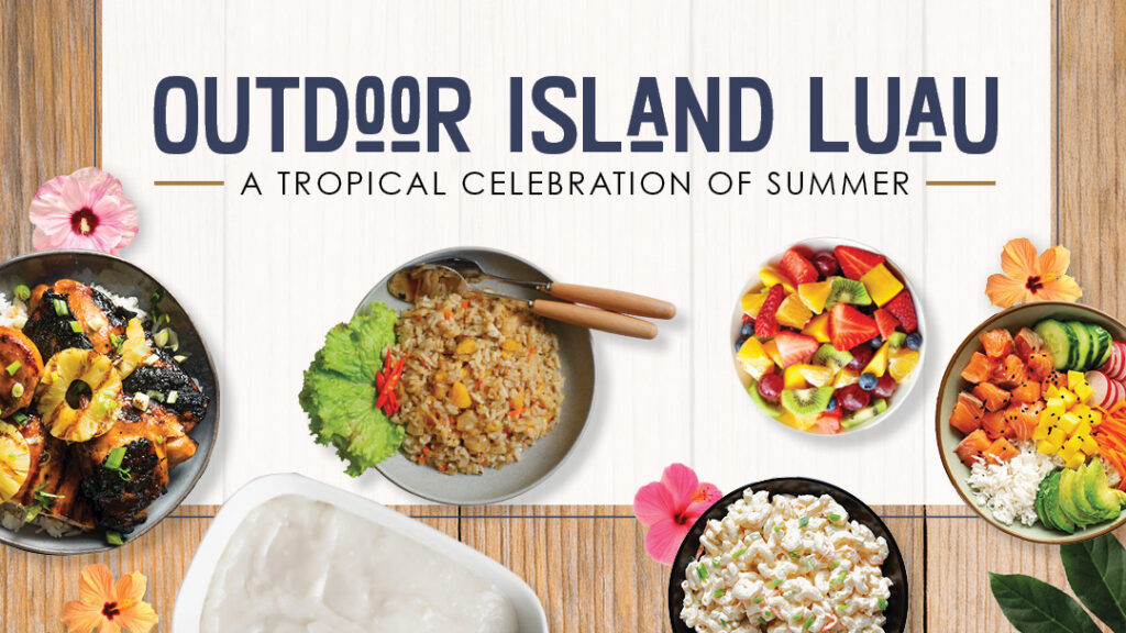 Bowls of tropical summer foods and flowers surround text reading “Outdoor Island Luau - A Tropical Celebration of Summer” on a wooden background.