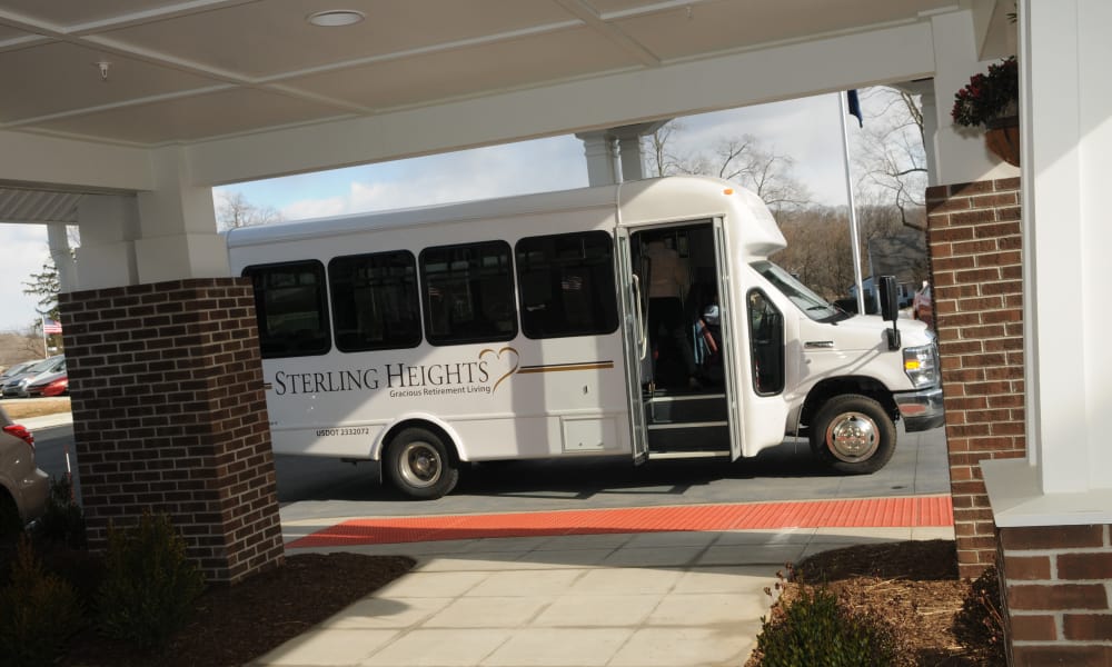 A white shuttle bus labeled 