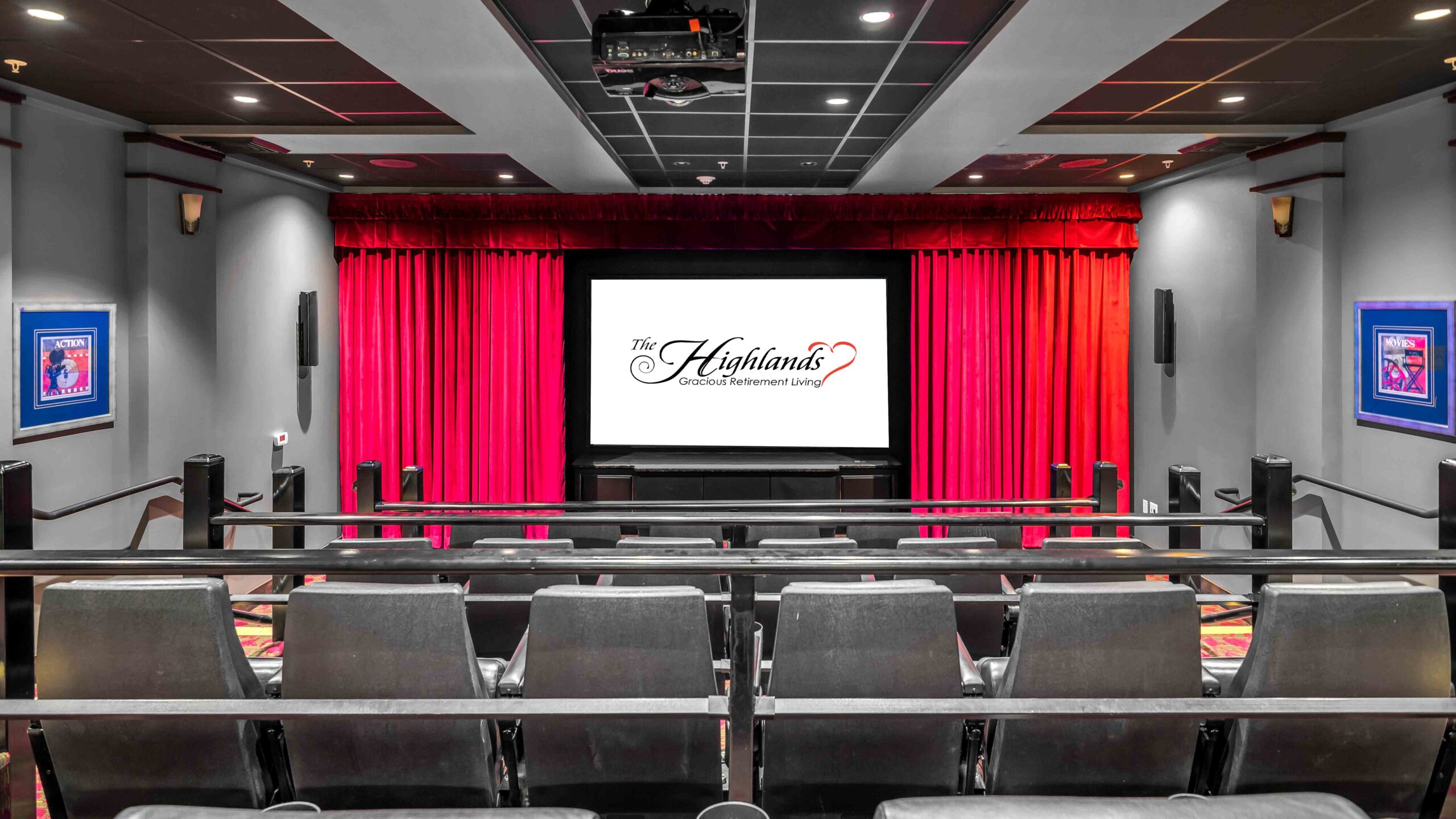 A small private movie theater with rows of black seats, a projector on the ceiling, red curtains framing the screen, and a large display reading "The Highlands." Blue posters adorn the gray walls.