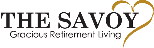 The Savoy Gracious Retirement Living logo featuring the text 'The Savoy' in large black font and 'Gracious Retirement Living' in smaller black font beneath it, accompanied by a stylized gold heart on the right.