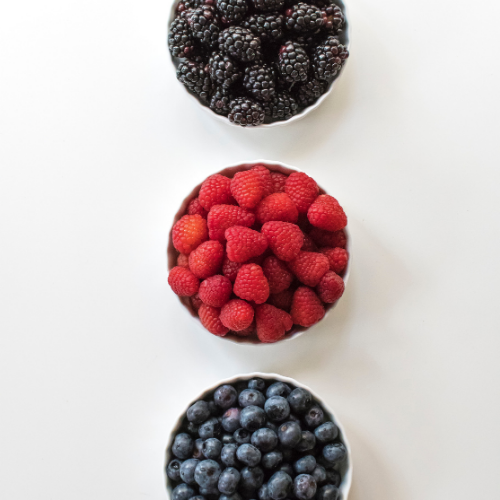 Blackberries, raspberries and blueberries in bowls