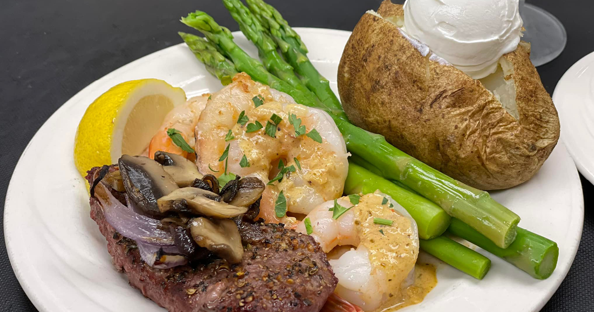 Plate of food - steak, shrimp, potato and asparagus