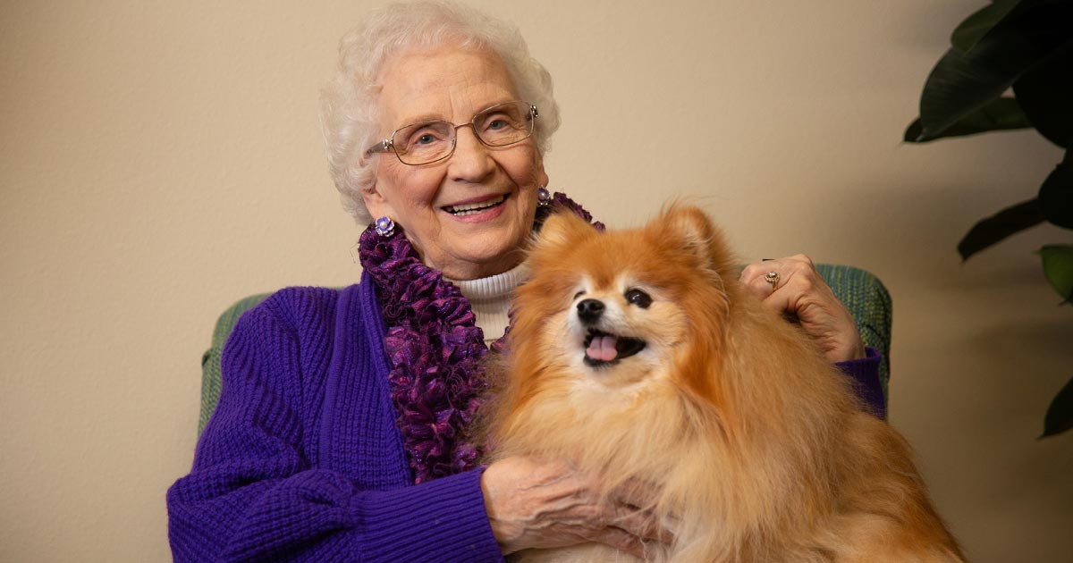 Senior woman holding her Pomeranian