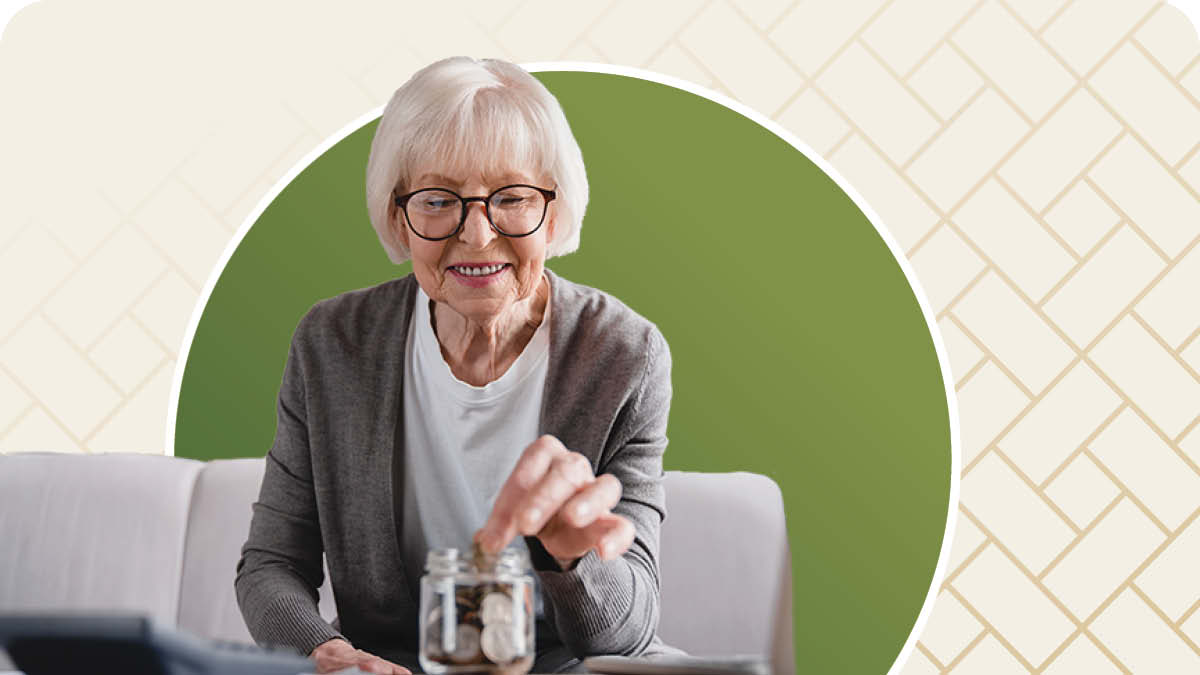 Senior woman with glasses putting change in a jar