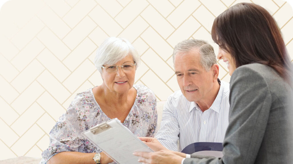 Woman reviewing paperwork with seniors