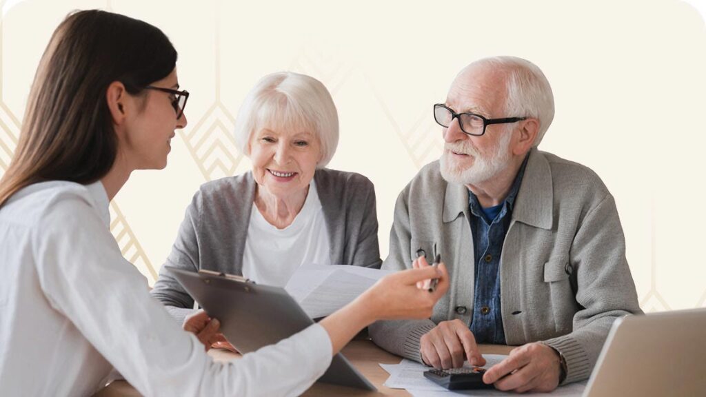 Senior couple reviewing paperwork with case worker