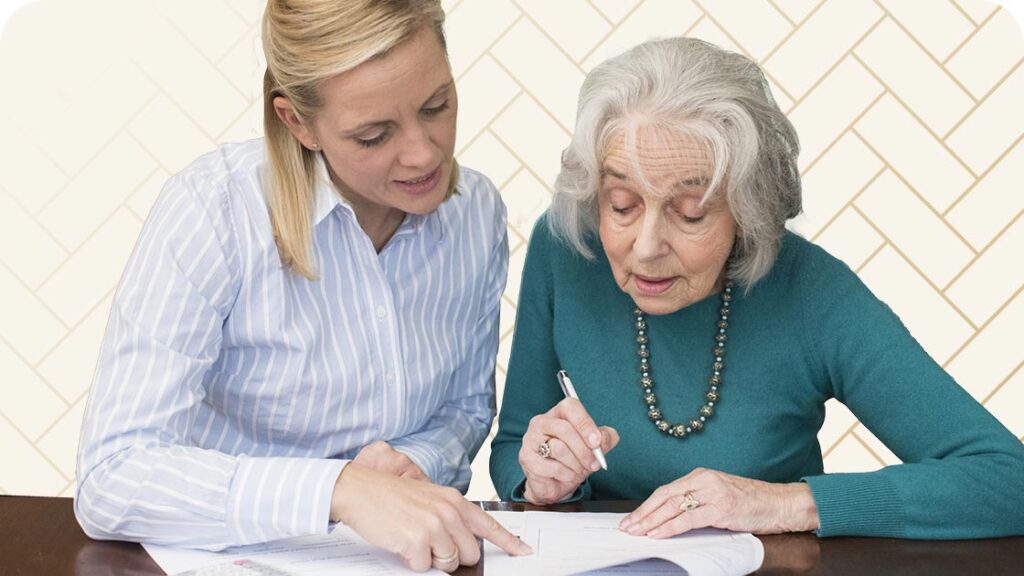 Woman reviewing paperwork with senior