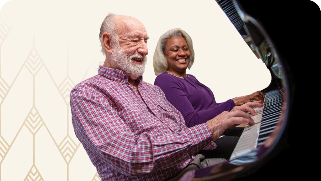 Senior couple playing piano
