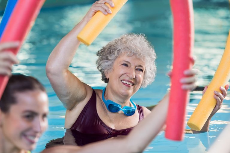 Seniors exercising in pool