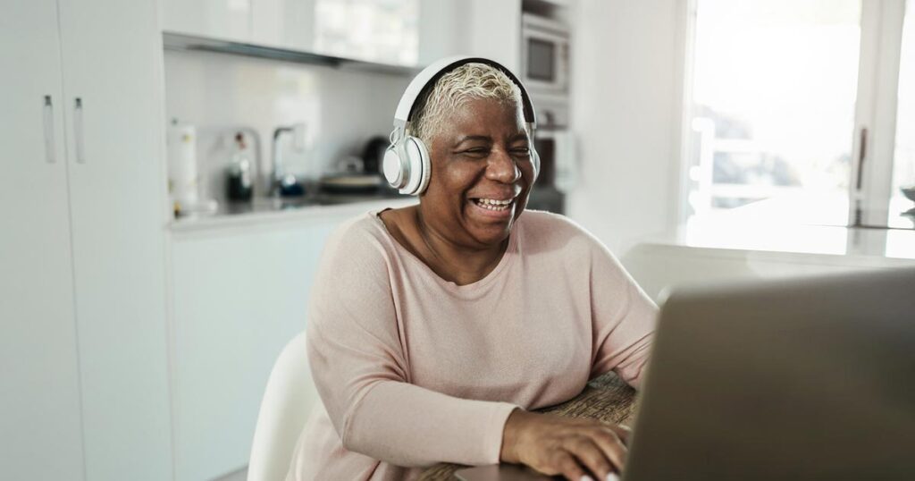 Young disabled woman using a voice controlled assistant